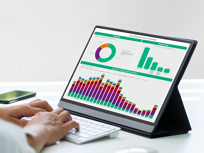 Employee analys the sterile goods data on his PC