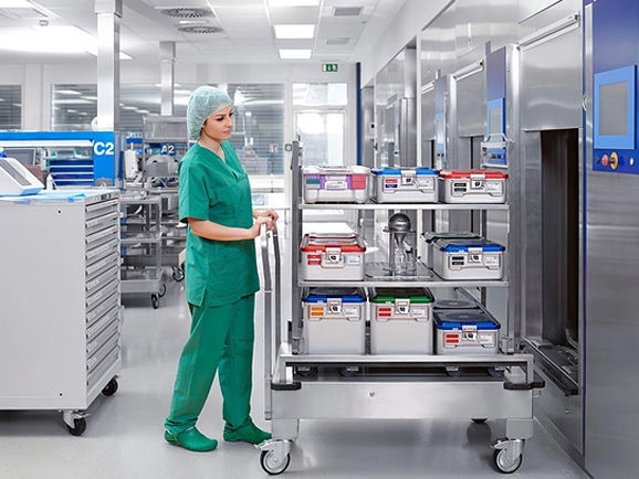 Female CSSD manager with sterile containers